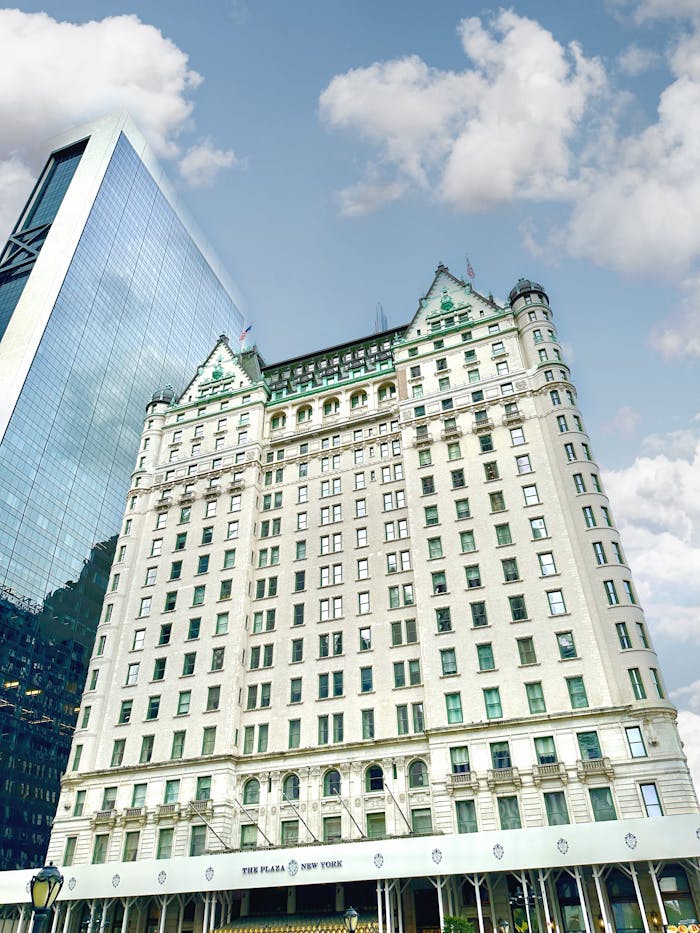 Iconic Plaza Hotel in New York City, showcasing its classic architecture against a vibrant sky.