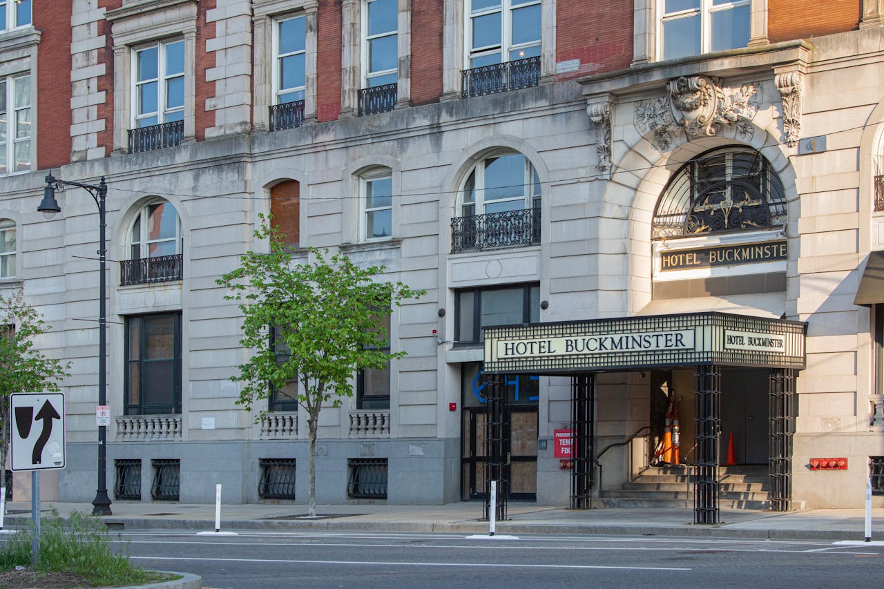 Street view of Hotel Buckminsters elegant facade in Boston, exemplifying classic urban architecture.